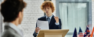 Young student presenting at debate.