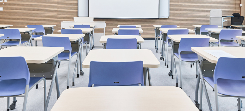 Rows of desk and chairs in a classroom