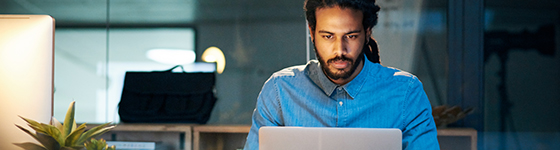 Black business man in office on computer