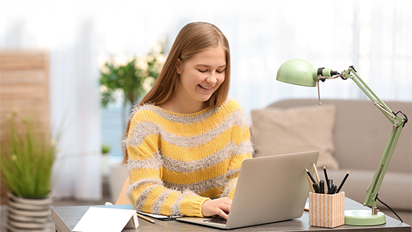 student studying on laptop