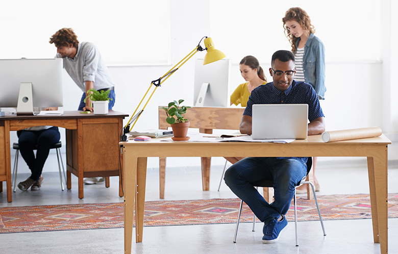 students at desks doing business research 