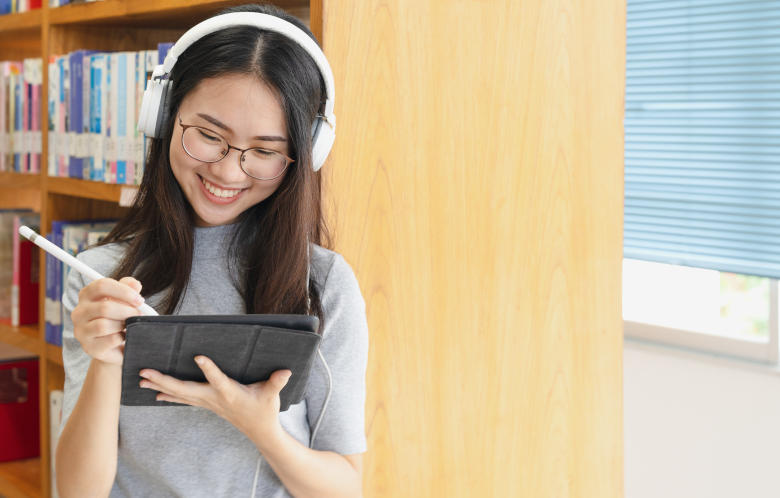 A library patron using a tablet device in the library