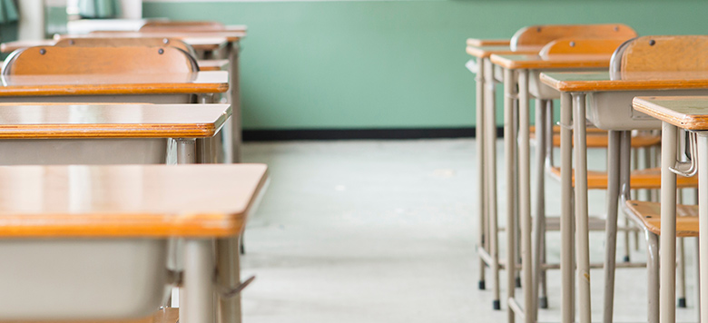 Row of desks in classroom