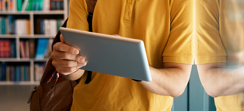 Student in library on tablet