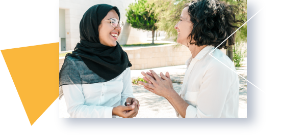 Two women having a discussion and smiling