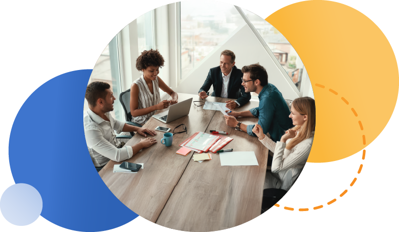 Group of employees at a conference table meeting and talking