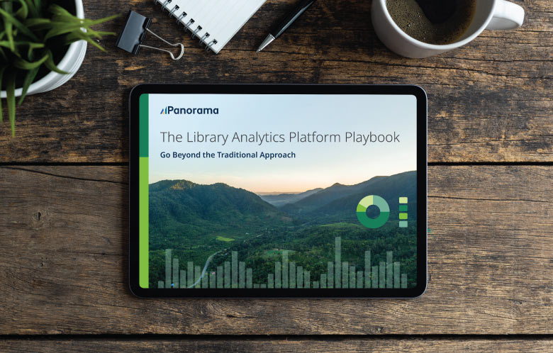 Panorama's "The Library Analytics Platform Playbook: Go Beyond the Traditional Approach” guide cover in tablet on table with plant, notebook, pen and coffee