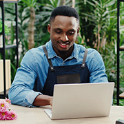 Flower shop owner on laptop